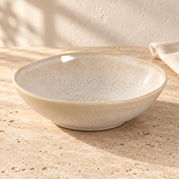 Reactive Glaze Ceramic Bowl Set in Latte on a sunlit travertine counter
