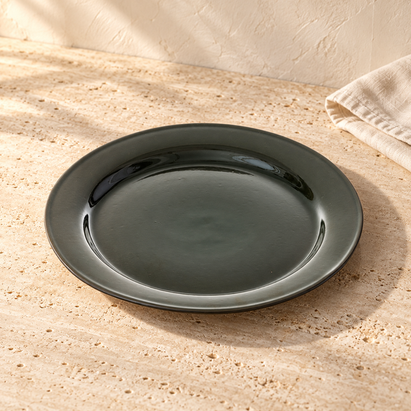 Glazed Stoneware Forest Green Dinner Plate in Ø13in on a sunlit travertine counter