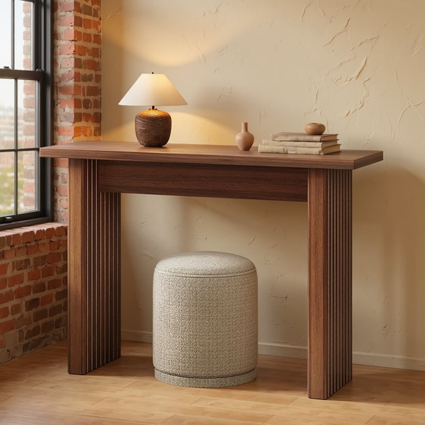 Walnut Fluted Narrow Entryway Console Table in a warm editorial loft with cream plaster, brick and natural daylight.