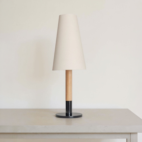 Linen Shade Wood-Stem Table Lamp on a neutral concrete tabletop