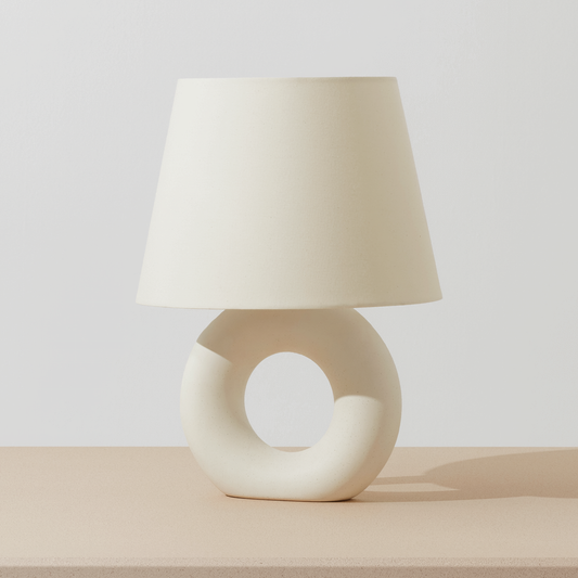 Ring-Base Ceramic Table Lamp on a neutral concrete tabletop