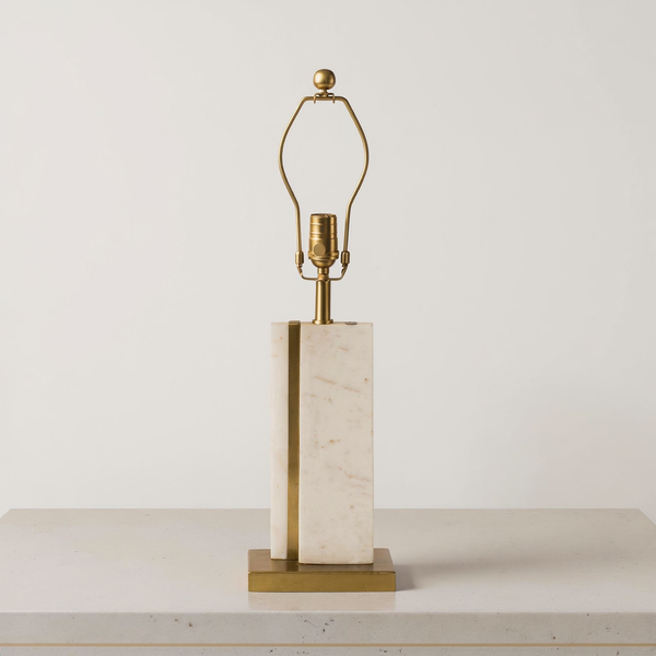 White Marble Brass-Accent Table Lamp on a neutral concrete tabletop