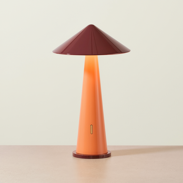 Cordless Cone Portable Table Lamp on a neutral concrete tabletop