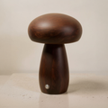 Rechargeable Mushroom LED Table Lamp with Touch Dimming on a neutral concrete tabletop