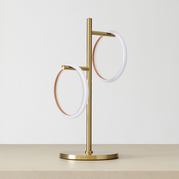 Saturn Table Lamp on a neutral concrete tabletop