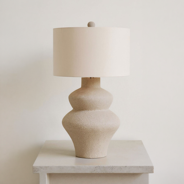 Jossleigh - Metal Table Lamp - Beige on a neutral concrete tabletop
