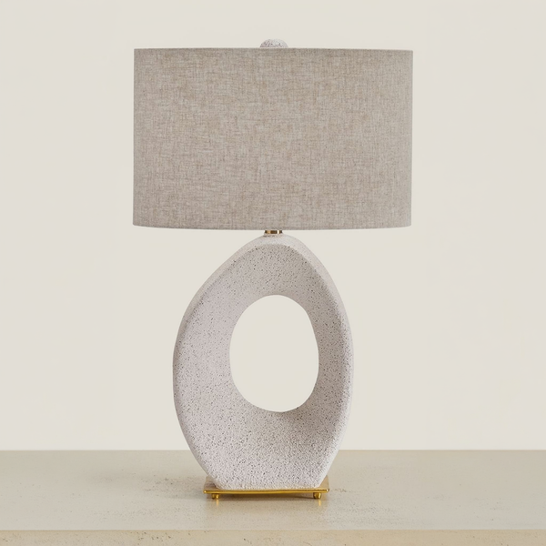 Trentlen - Paper Table Lamp - Cream / Gold Finish on a neutral concrete tabletop