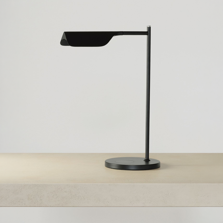 Adjustable Swing Arm Wireless Charging Table Lamp on a neutral concrete tabletop