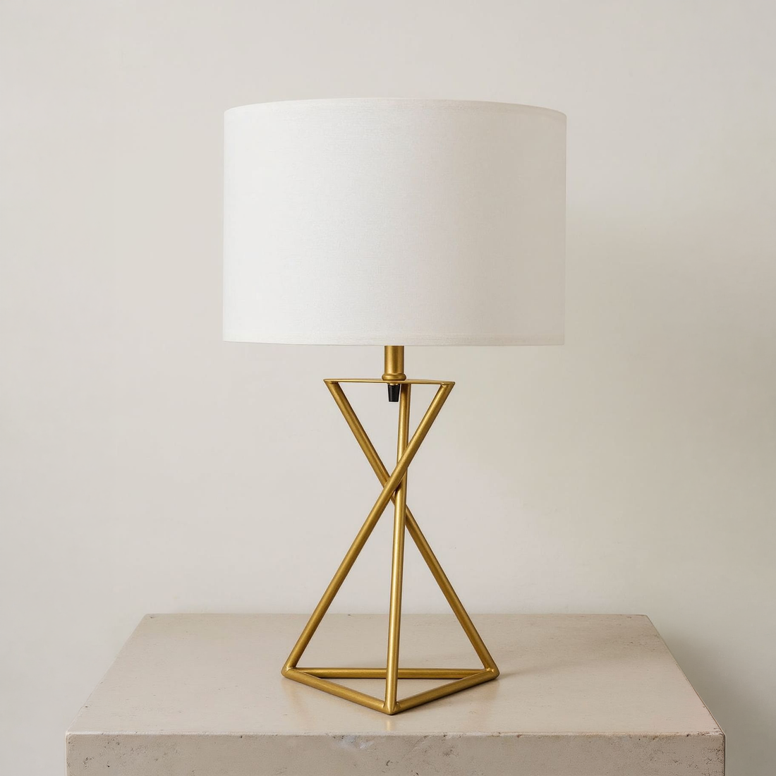 Geometric Matte Gold Metal Table Lamp on a neutral tabletop