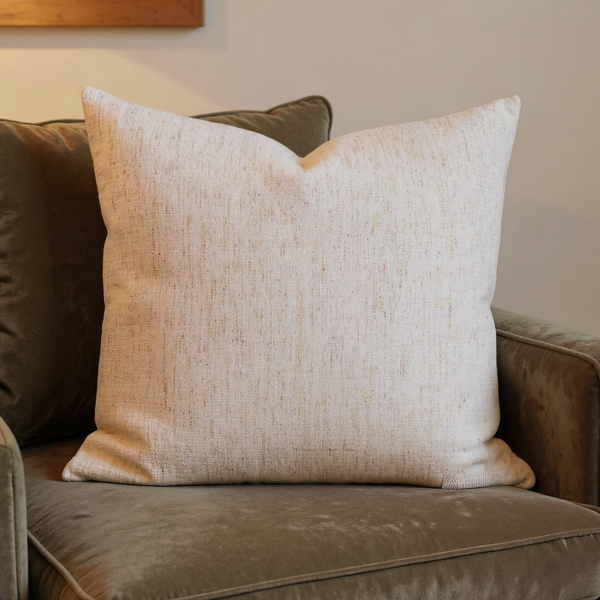 Slub Chenille Bone Throw Pillow in a close view on coordinated upholstered seating