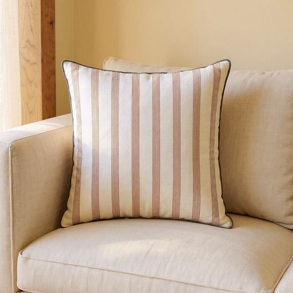Striped Cotton Throw Pillow in a close view on coordinated upholstered seating
