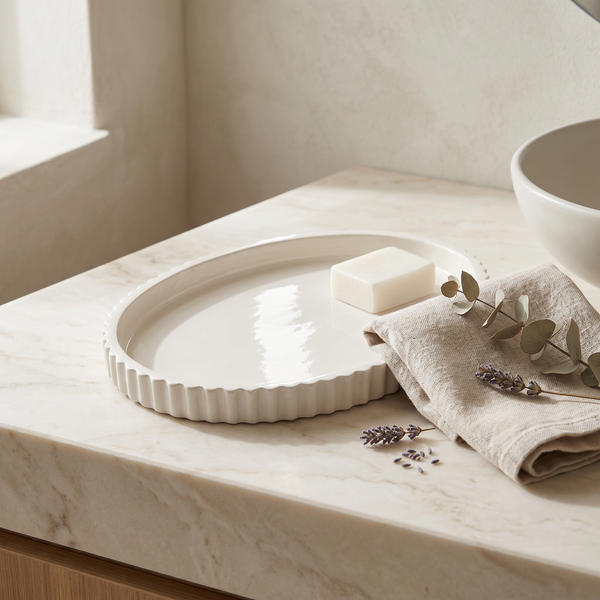 Scalloped Gypsum Oval Catchall Tray in a styled room setting