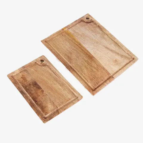 Mango Wood Cutting Board Set styled on a countertop with bread and linen