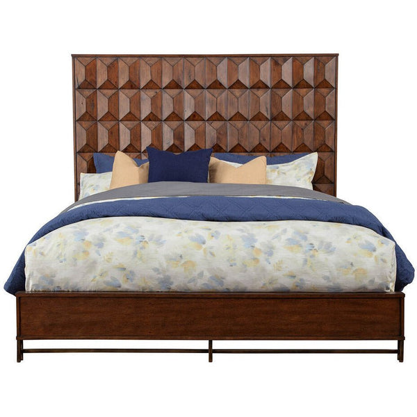 Brown geometric bed with blue and floral bedding shown straight on against white.