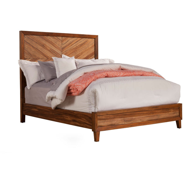 Brown chevron panel bed with pale bedding and coral throw against white.