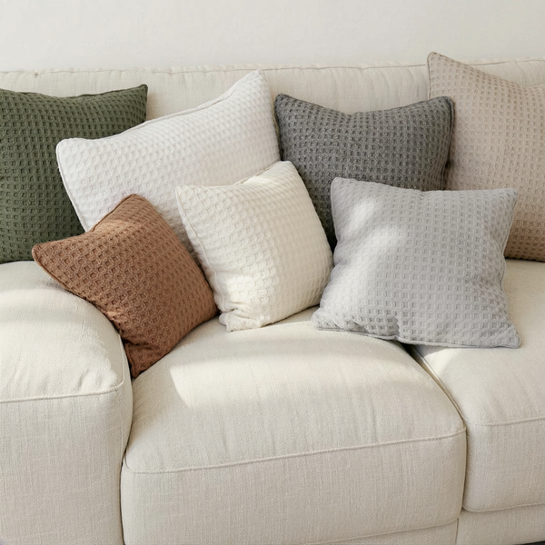 Waffle-Knit Memory Foam Throw Pillow color options styled together on coordinated seating
