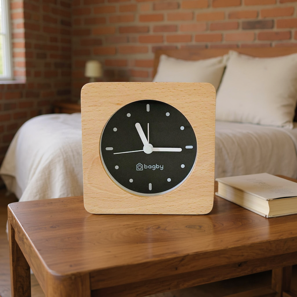 Wood Frame Silent Analog Alarm Clock styled in a warm editorial loft