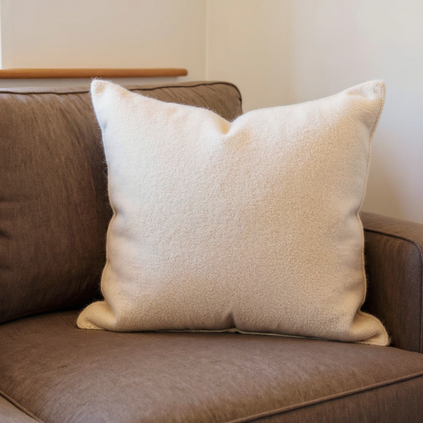 Wooly Boucle Throw Pillow in a close view on coordinated upholstered seating